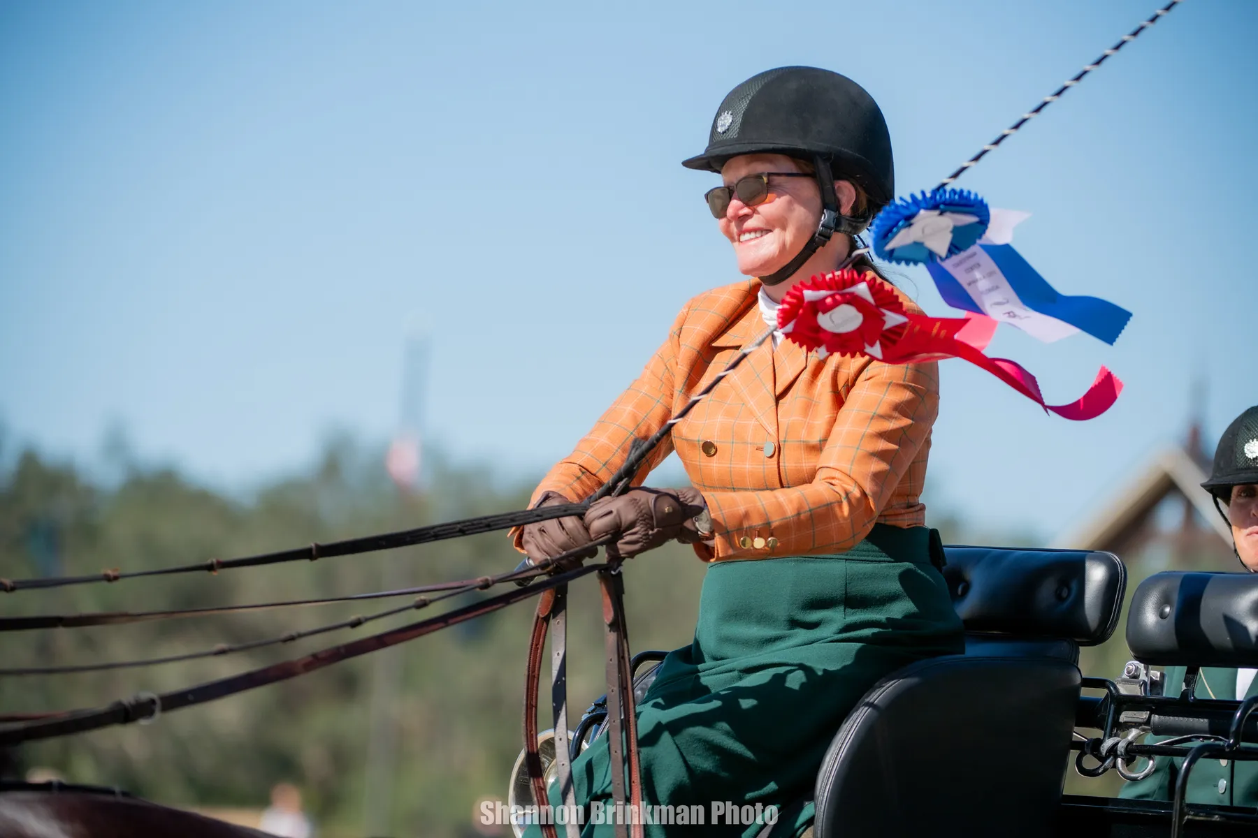 A winning driver with ribbons at the TerraNova CDE