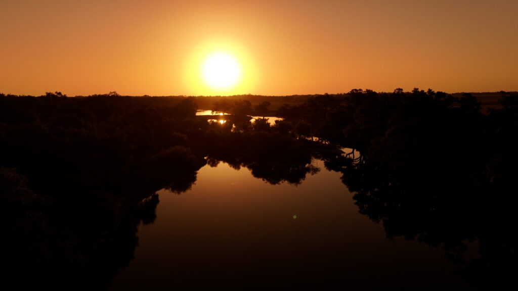 Sunset over the lake at TerraNova Equestrian Center, the setting for retreats and clinics in Myakka City, Florida